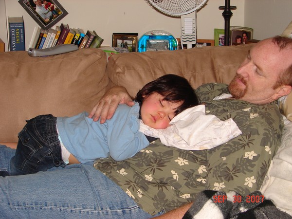 Sleeping on papa! Photo